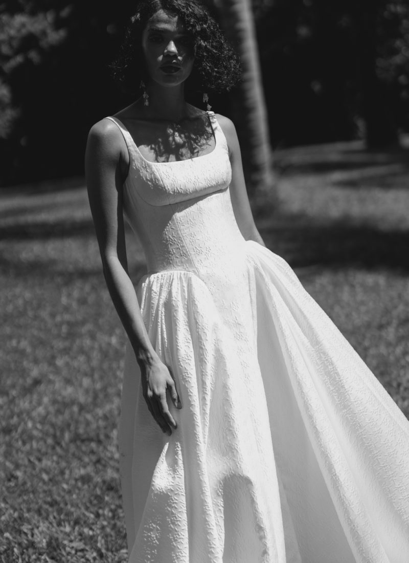 Model wearing a modern wedding dress by Alena Leena