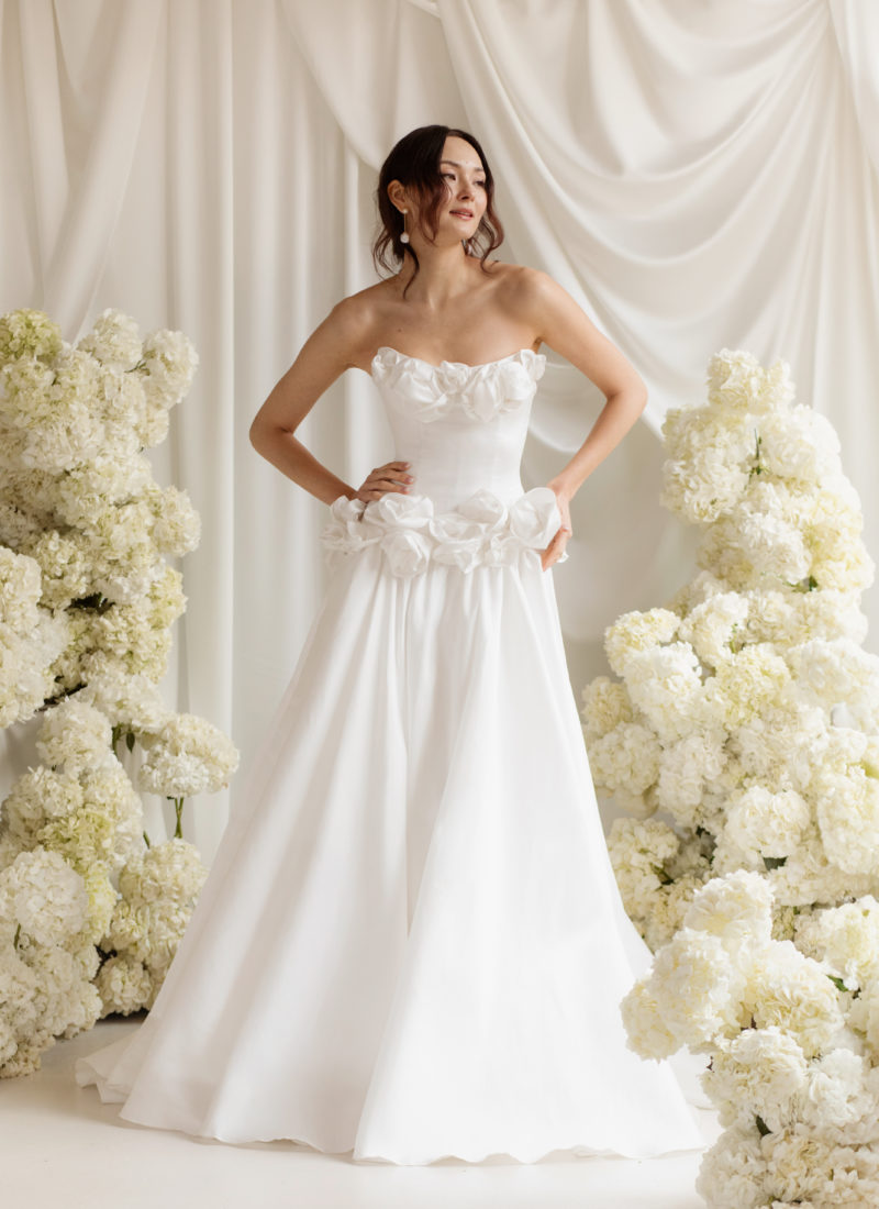 Modern wedding dress with large flower detail