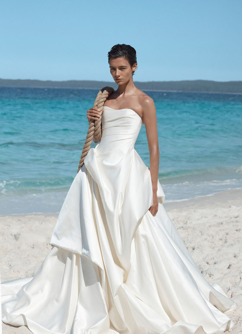 Model wearing a modern wedding dress by KYHA