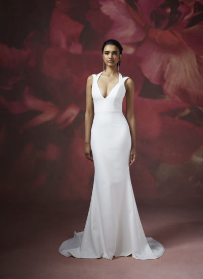 model wearing a V neck crepe wedding dress